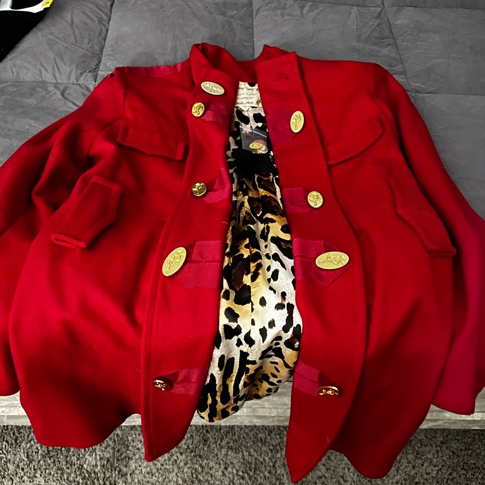 Red coat with animal print lining. Beautiful gold button detail